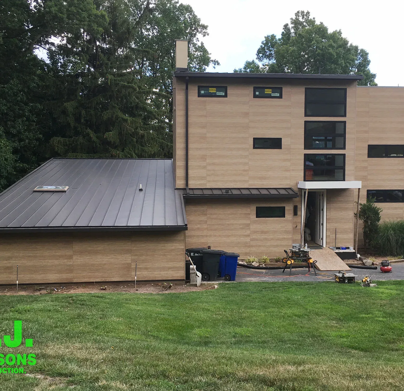 Exterior view featuring Nichiha fiber cement siding, a durable and stylish alternative to traditional wood siding, showcasing a modern and appealing facade with a wood-like appearance