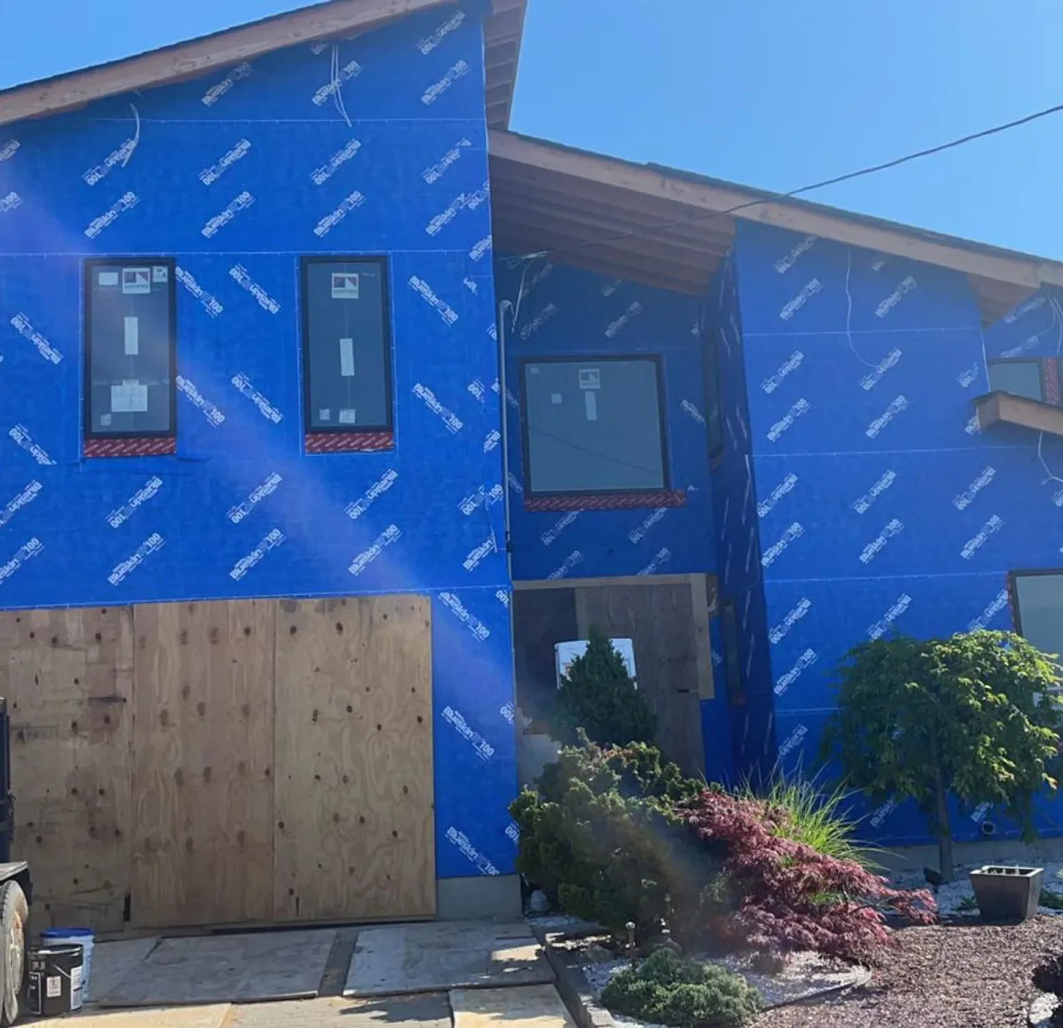 Bare house covered in homewrap getting ready to install Nichiha siding