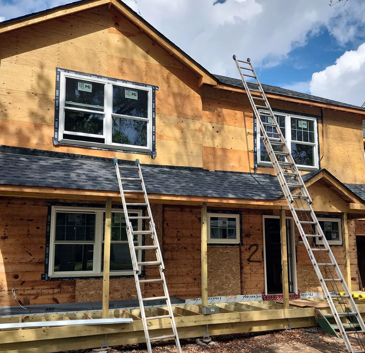 Removing old siding to bare wall sheathing, getting home ready for deep blue Norandex vinyl siding